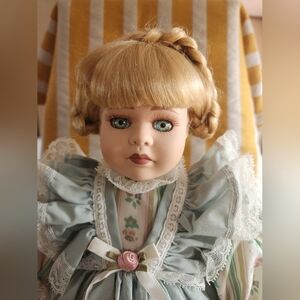 Classic Blonde Porcelain Doll with Green Dress